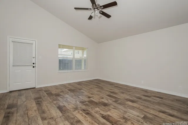 a view of an empty room with a window