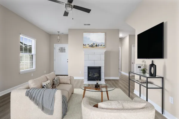 a living room with furniture and a flat screen tv