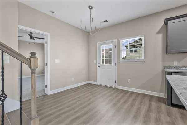 a view of livingroom with hardwood floor and a ceiling fan