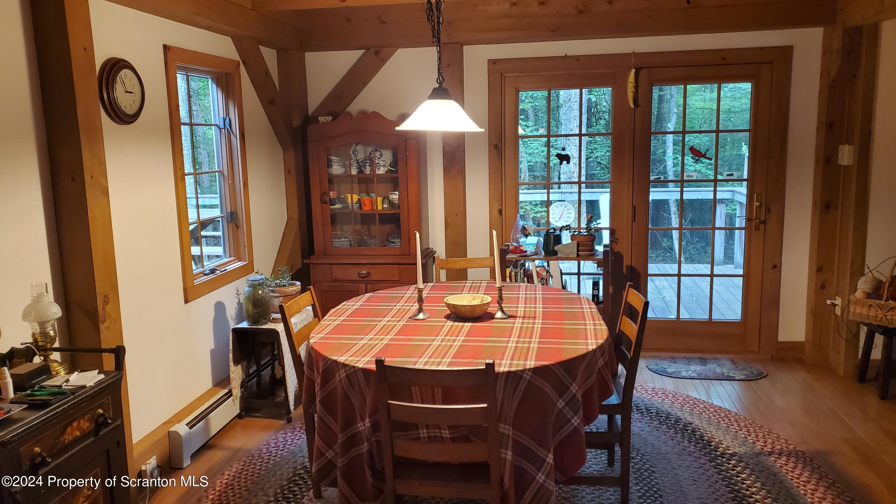 1508 Graham Holw Road Hallstead, PA 18822 - Photo 12 of 32 a dining room with furniture window and wooden floor