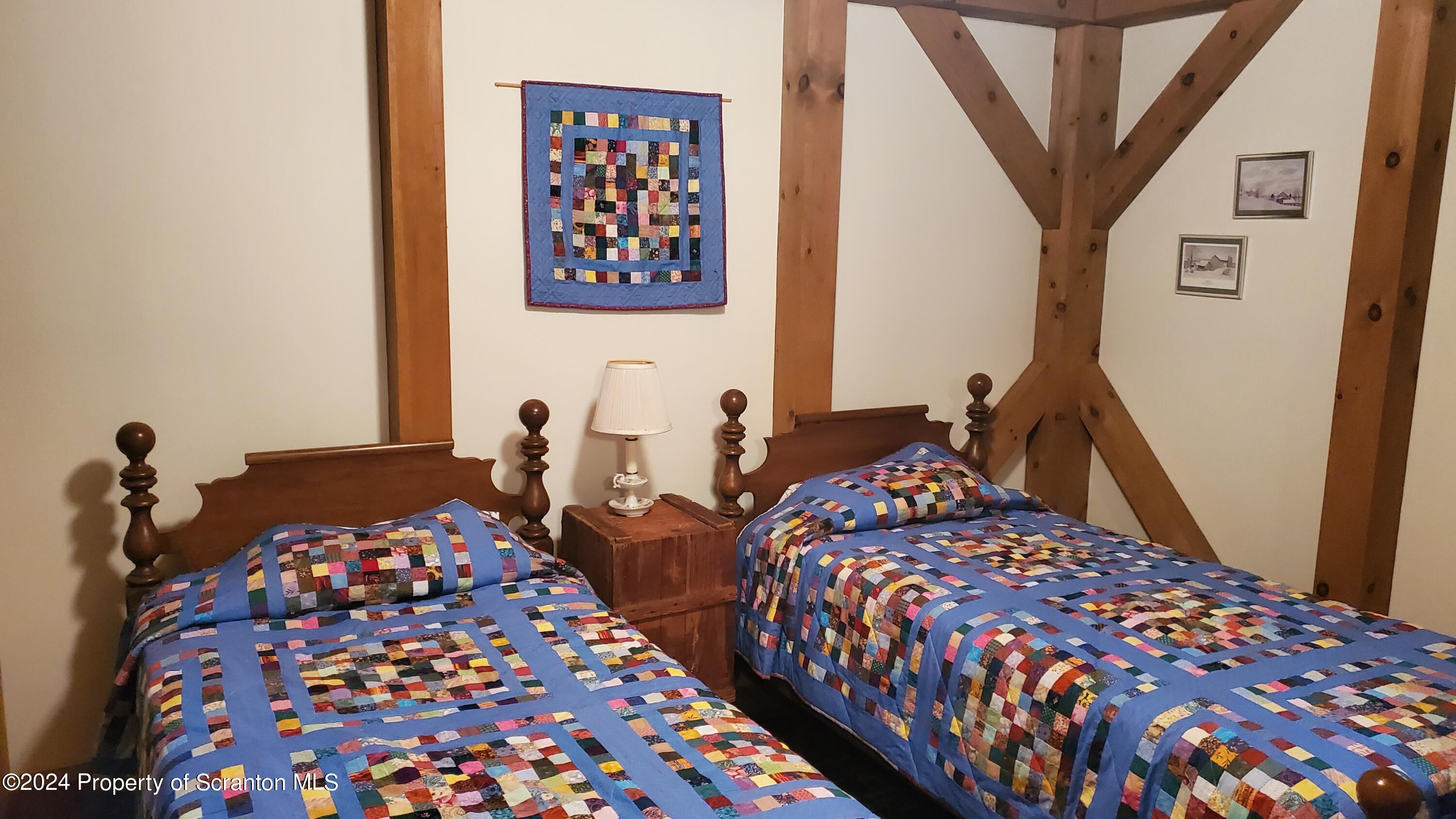 1508 Graham Holw Road Hallstead, PA 18822 - Photo 13 of 32 a bedroom with bed and a painting on the wall