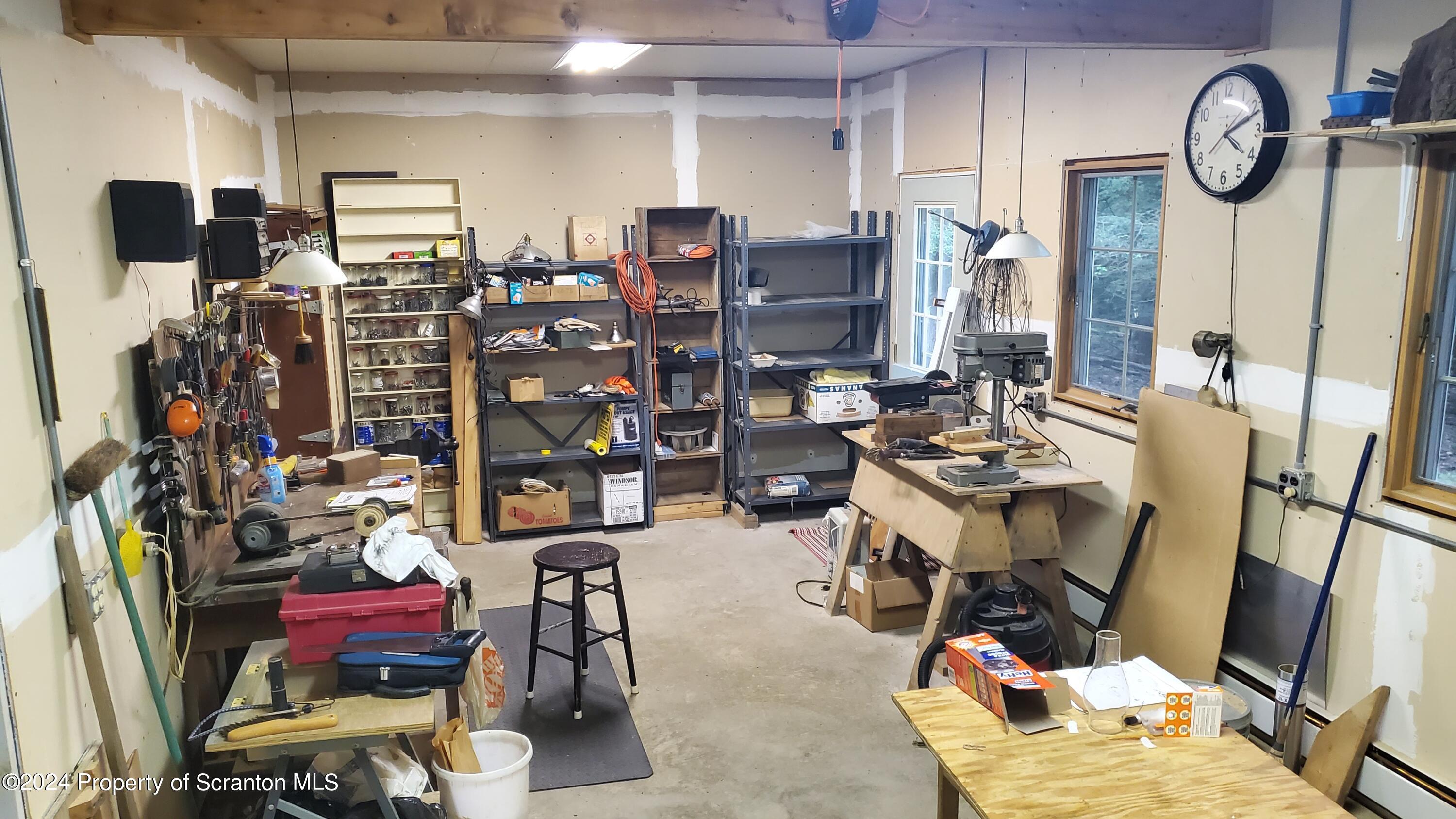 1508 Graham Holw Road Hallstead, PA 18822 - Photo 16 of 32 a view of a workspace with furniture and a window