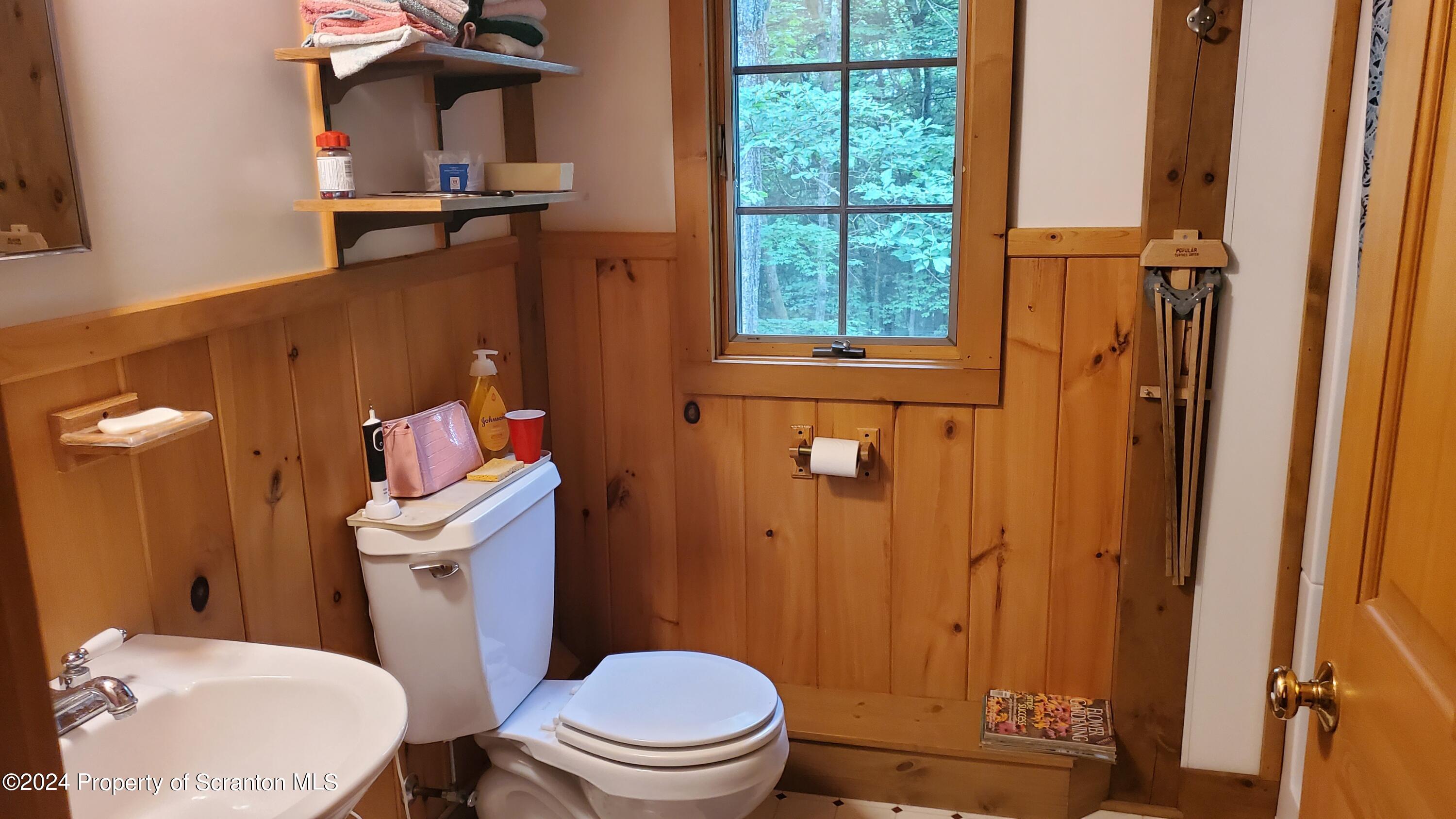 1508 Graham Holw Road Hallstead, PA 18822 - Photo 21 of 32 a white toilet sitting next to a bathroom sink