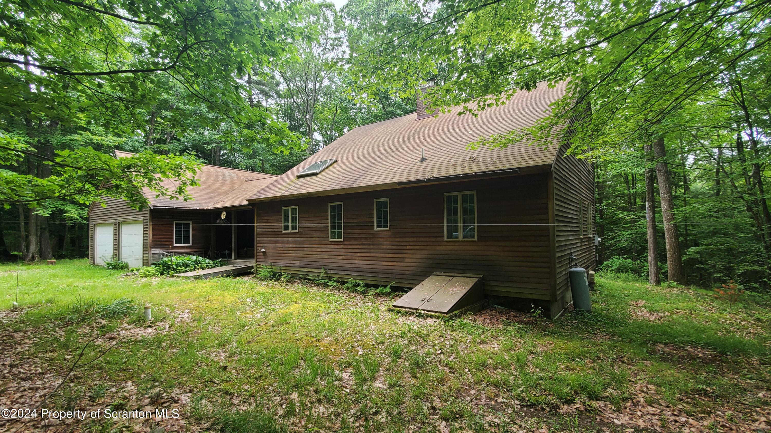 1508 Graham Holw Road Hallstead, PA 18822 - Photo 3 of 32 a backyard of a house with table and chairs