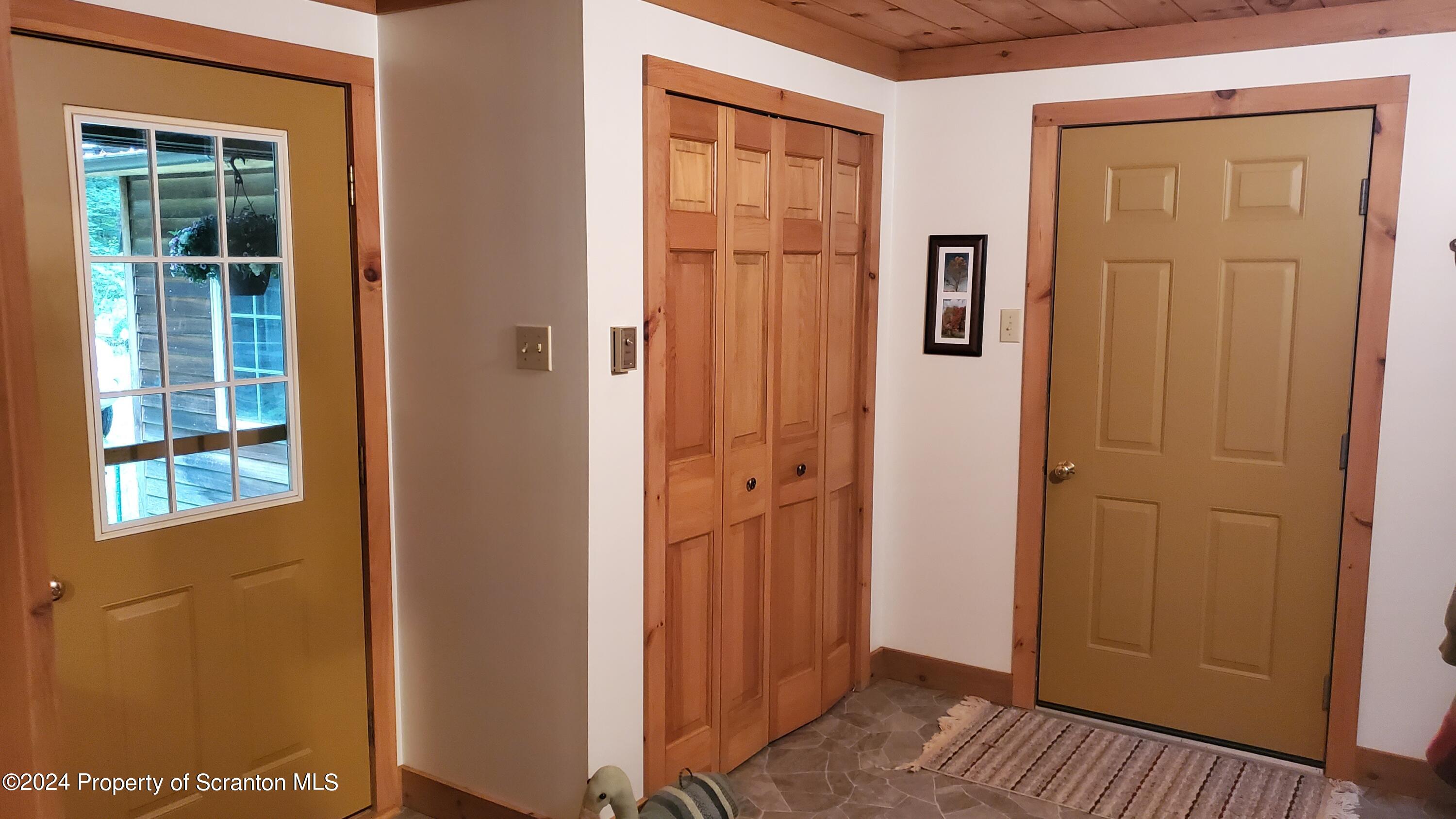 1508 Graham Holw Road Hallstead, PA 18822 - Photo 7 of 32 a view of a hallway with wooden floor and windows
