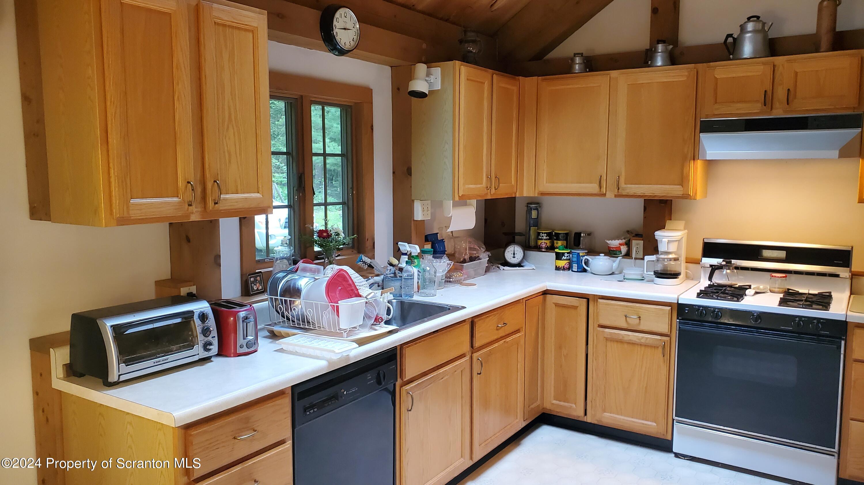 1508 Graham Holw Road Hallstead, PA 18822 - Photo 10 of 32 a kitchen with a sink cabinets and window