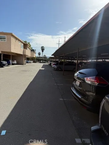 a view of street with parked cars