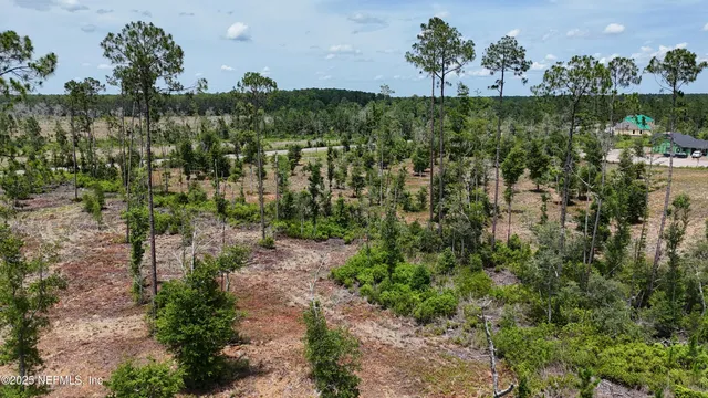 a view of a lake with beach and mountain view