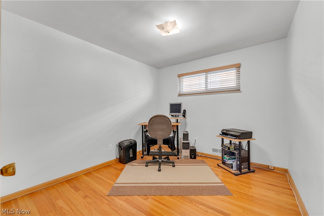 3023 Norris Avenue Cleveland, OH 44134 - Photo 21 of 41 Versatile interior space featuring light wood-finish flooring, white painted walls, and a single window with blinds