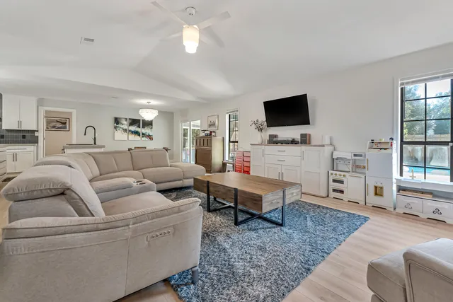 a view of kitchen with cabinets and wooden floor