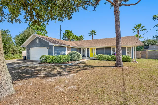 a view of a house with a garden