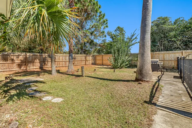an aerial view of a residential houses with outdoor space