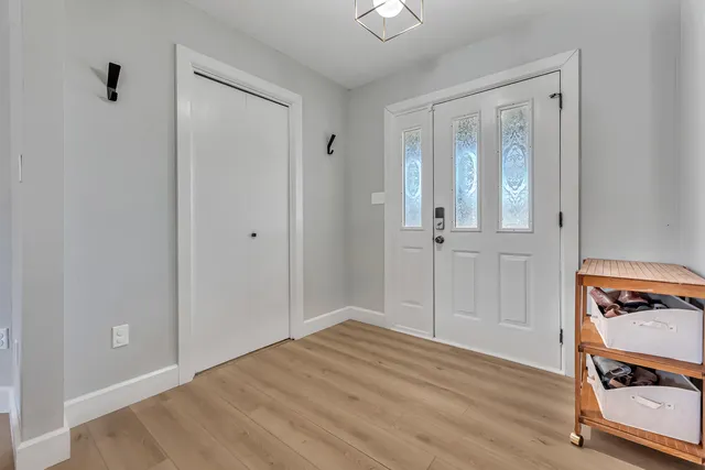 a living room with furniture and flat screen tv