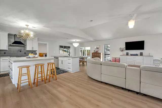 a living room with furniture and flat screen tv
