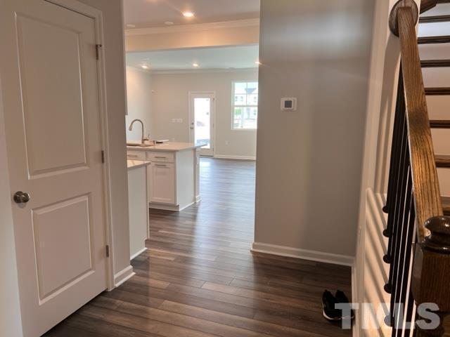 2403 Chert Lane, Unit 2403 Raleigh, NC 27610 - Photo 5 of 19 a view of a hallway with wooden floor and closet
