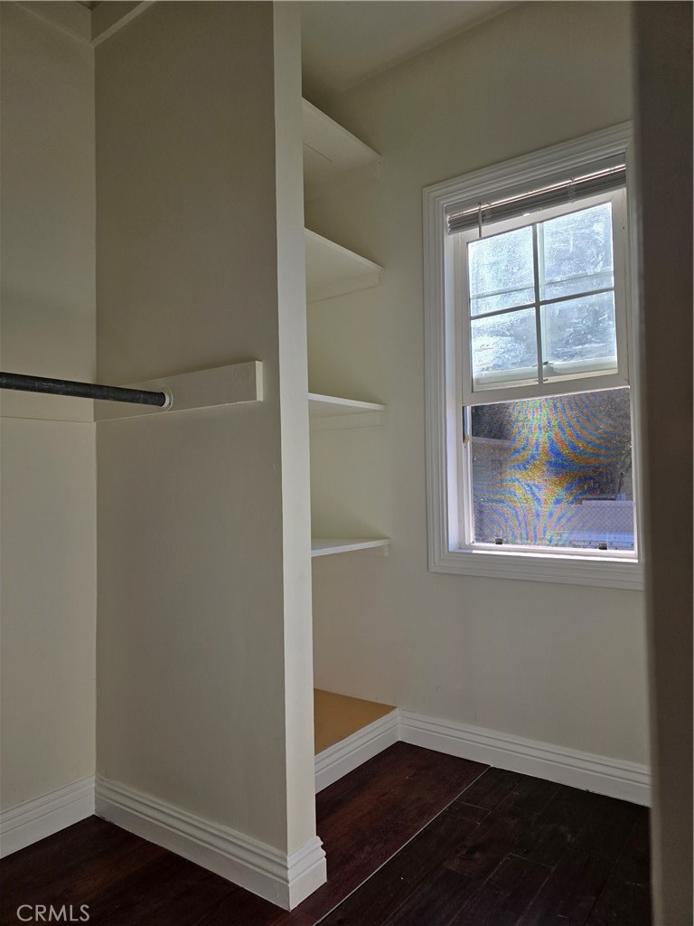 45371 Cardiff Street Hemet, CA 92544 - Photo 11 of 14 a view of an empty room with wooden floor and a window