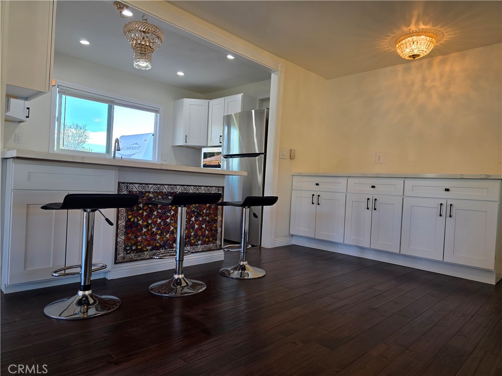 45371 Cardiff Street Hemet, CA 92544 - Photo 4 of 14 a kitchen with counter top space and appliances