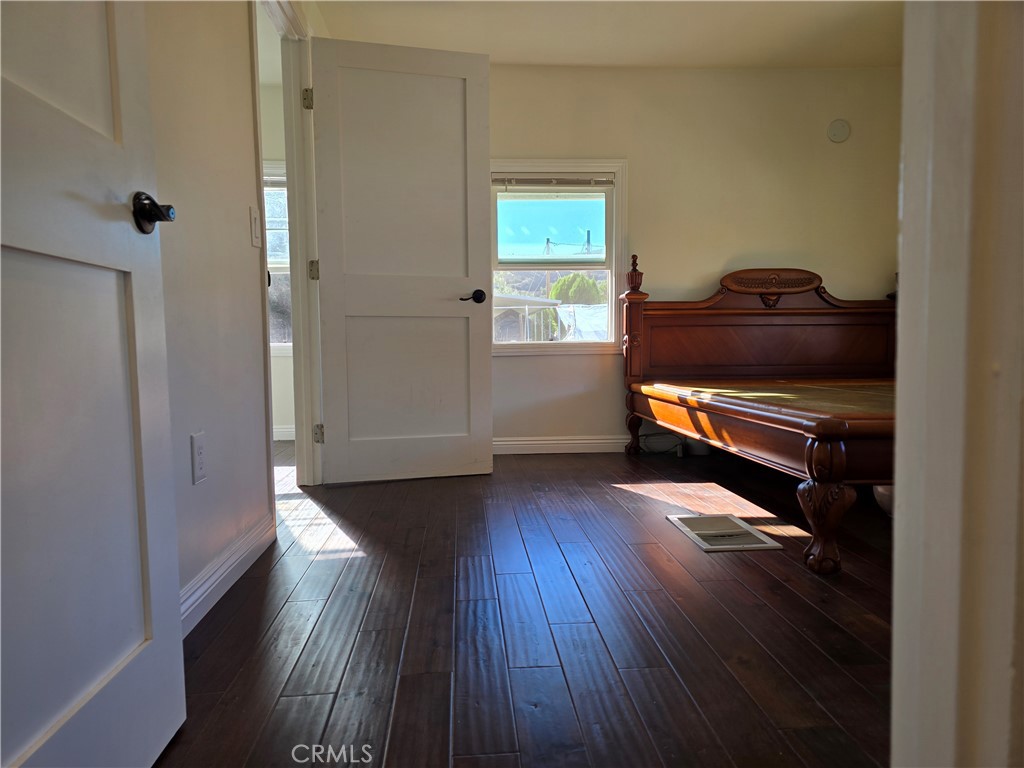 45371 Cardiff Street Hemet, CA 92544 - Photo 10 of 14 a view of hallway with wooden floor and stairs