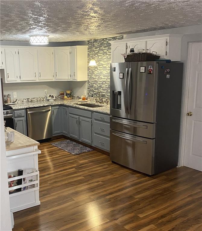149 North View Heights Road New Florence, PA 15944 - Photo 16 of 31 a kitchen with granite countertop stainless steel appliances and wooden cabinets
