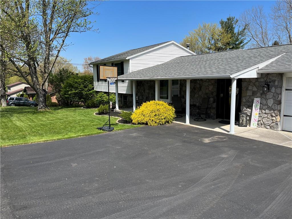 149 North View Heights Road New Florence, PA 15944 - Photo 2 of 31 a view of a house with a yard and potted plants