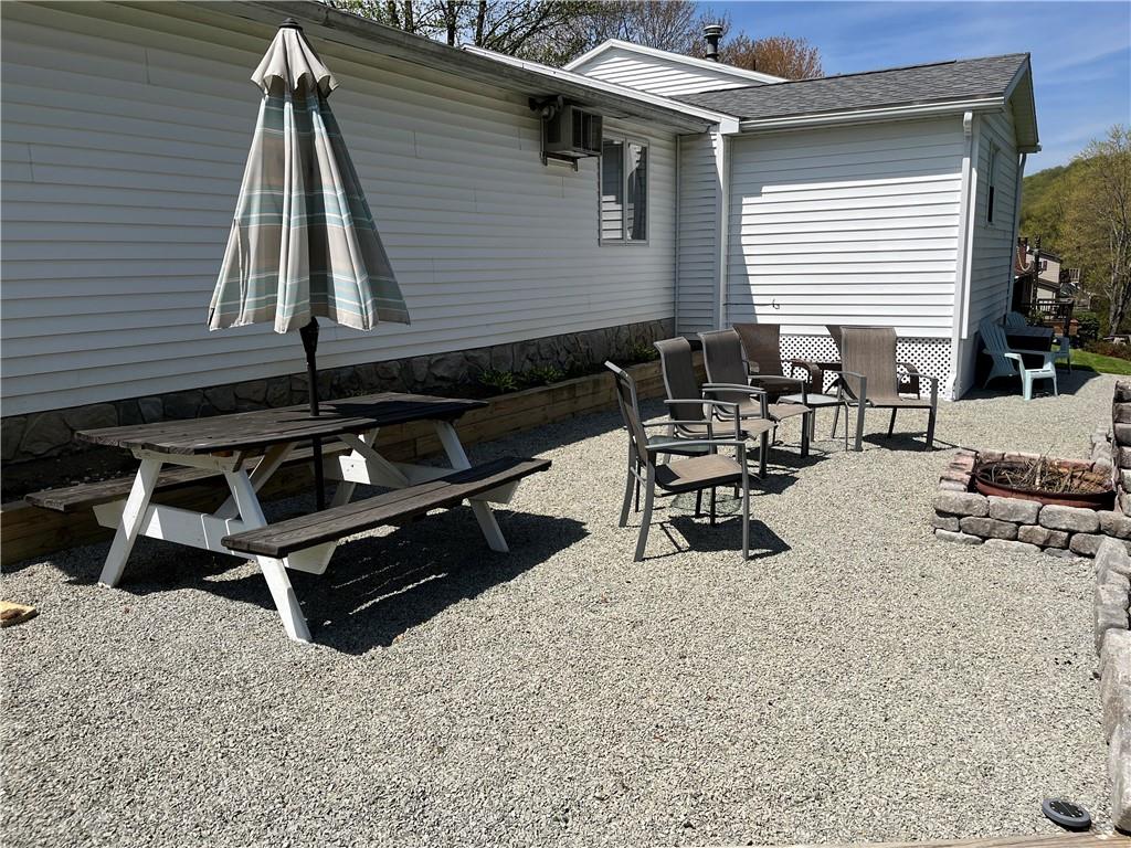 149 North View Heights Road New Florence, PA 15944 - Photo 3 of 31 a backyard of a house with table and chairs