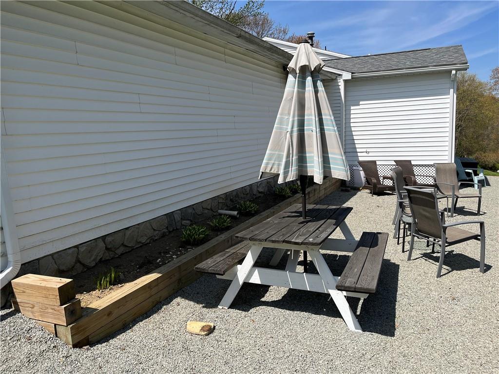 149 North View Heights Road New Florence, PA 15944 - Photo 4 of 31 a blue and white bench sitting in front of a house