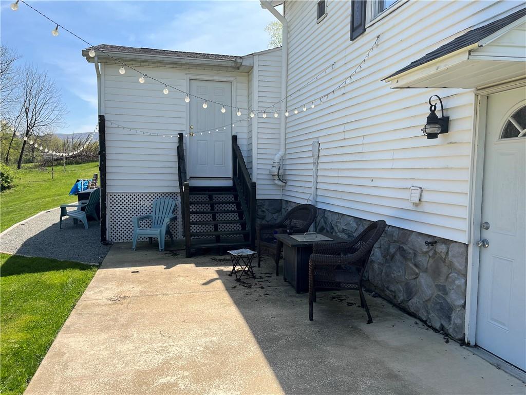 149 North View Heights Road New Florence, PA 15944 - Photo 6 of 31 a view of backyard with a chair and a patio
