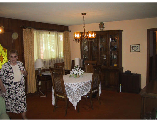 81 Pequot Road Southampton, MA 01073 - Photo 3 of 5 a living room with furniture and a chandelier