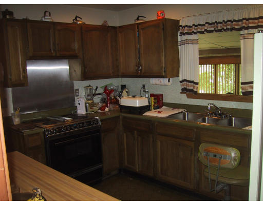 81 Pequot Road Southampton, MA 01073 - Photo 4 of 5 a kitchen with sink cabinets and stainless steel appliances