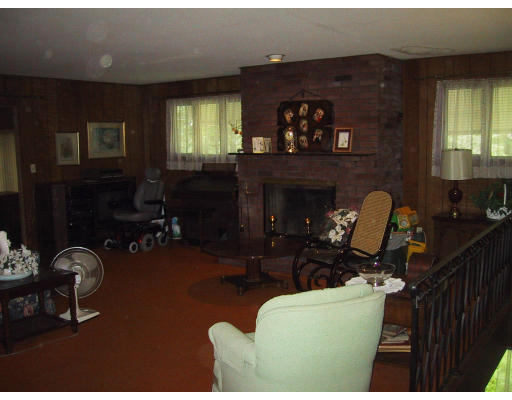 81 Pequot Road Southampton, MA 01073 - Photo 5 of 5 a living room with furniture a lamp and a fireplace