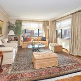 a living room with furniture and a rug