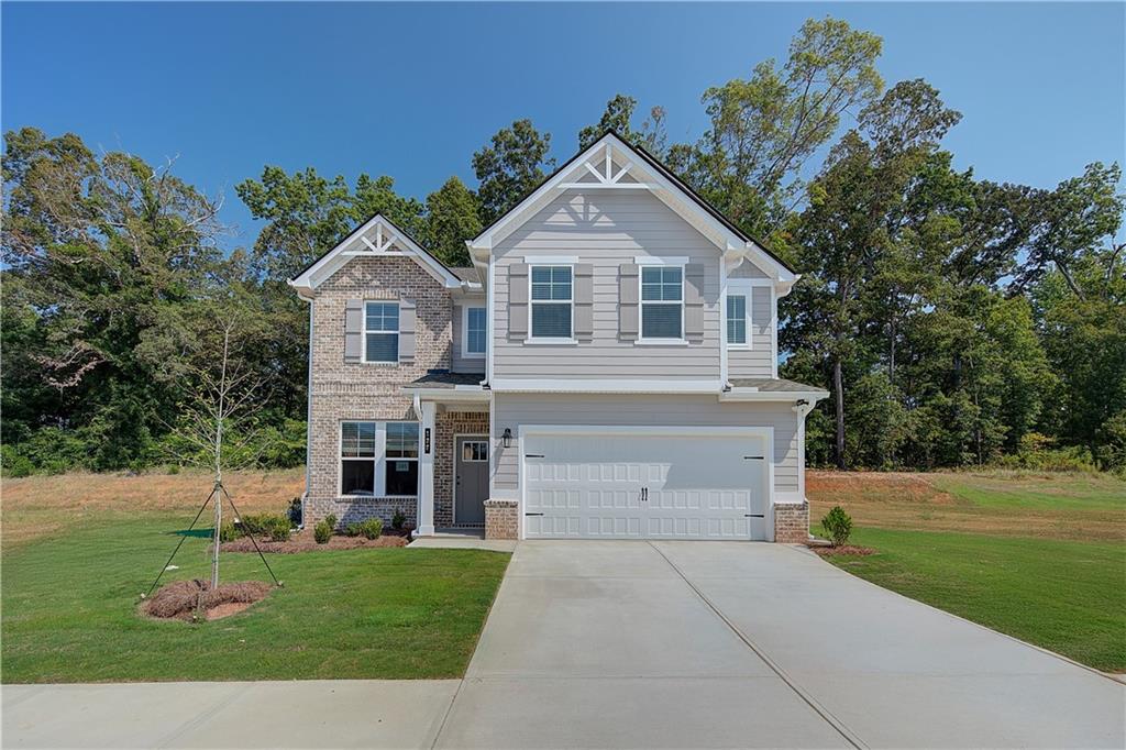 119 St Anne's Place Covington, GA 30016 - Photo 1 of 30 a front view of a house with a yard