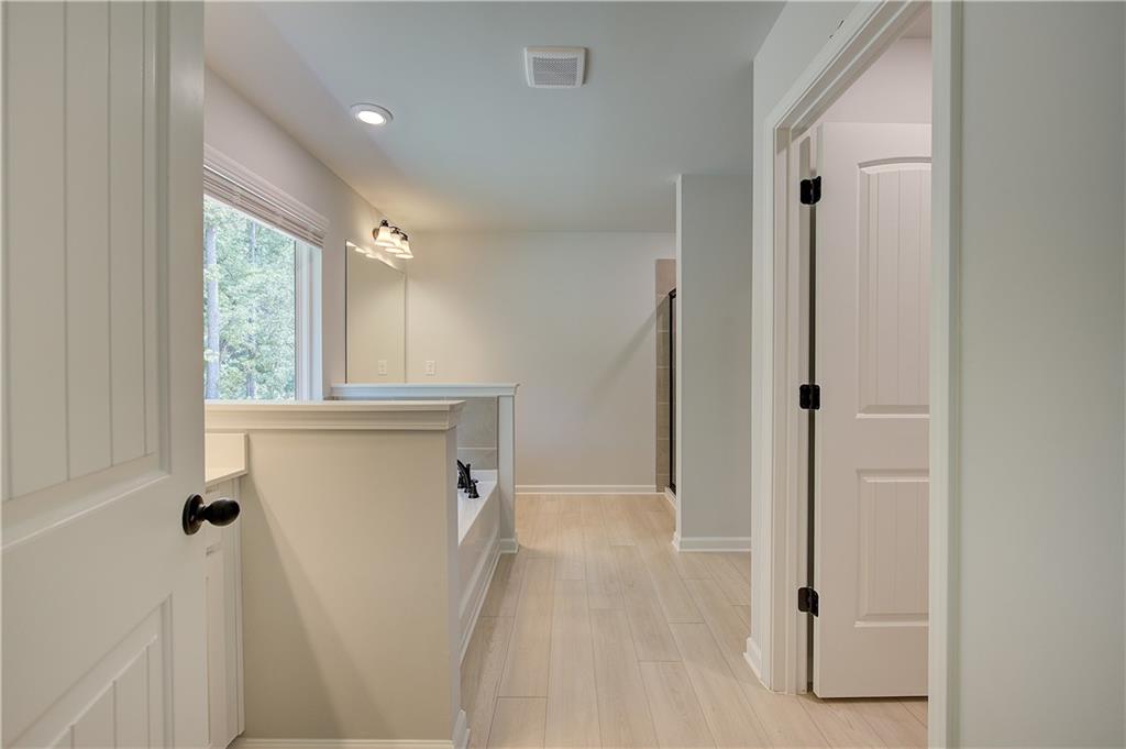 119 St Anne's Place Covington, GA 30016 - Photo 24 of 30 a view of a hallway with windows and entryway