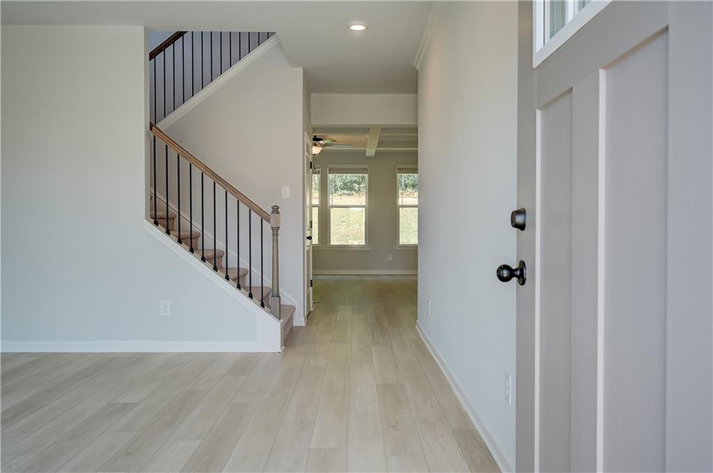 119 St Anne's Place Covington, GA 30016 - Photo 4 of 30 a view of hallway with wooden floor
