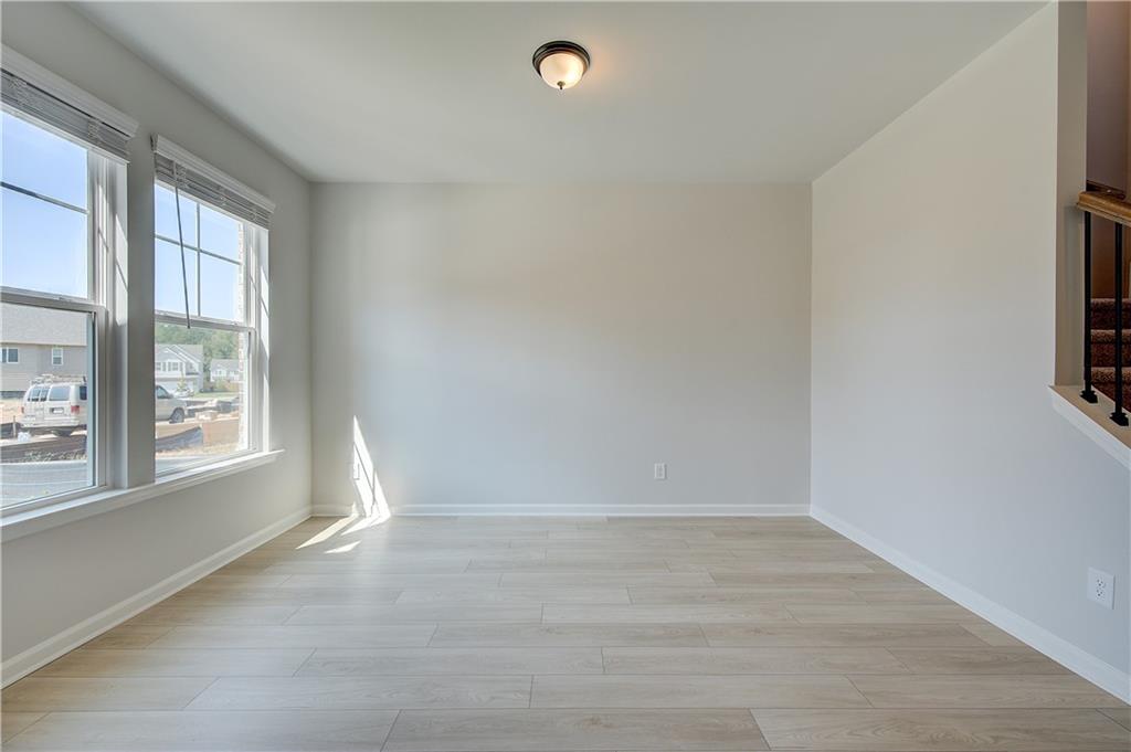 119 St Anne's Place Covington, GA 30016 - Photo 5 of 30 an empty room with windows