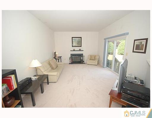 21 Maher Road Somerset, NJ 08873 - Photo 4 of 8 a living room with furniture and a flat screen tv