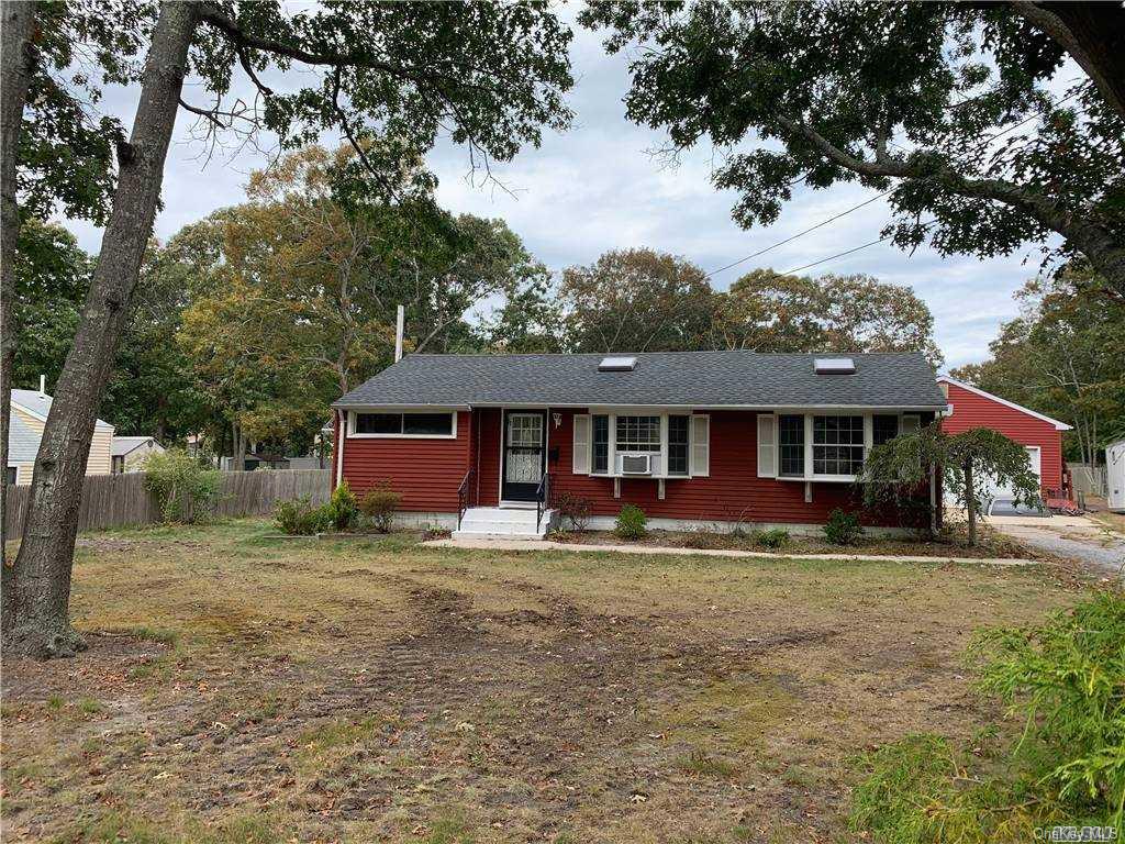 13 Long Lane Hampton Bays, NY 11946 - Photo 1 of 1 a front view of a house with a yard