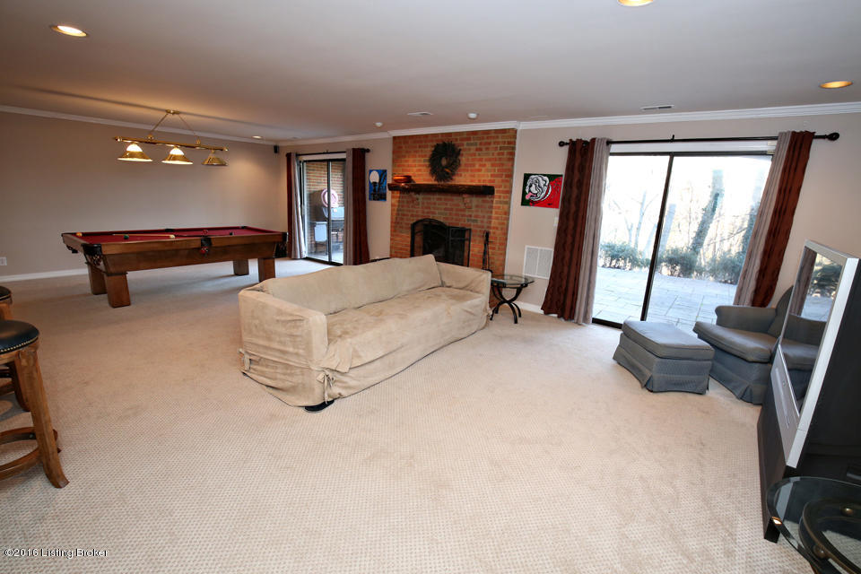 1005 Devon Road Goshen, KY 40026 - Photo 39 of 55 The large Great Room in the WALKOUT level has a fireplace, bathroom, large bar & sliding glass doors to the patio. Perfect for fun & entertaining large groups!