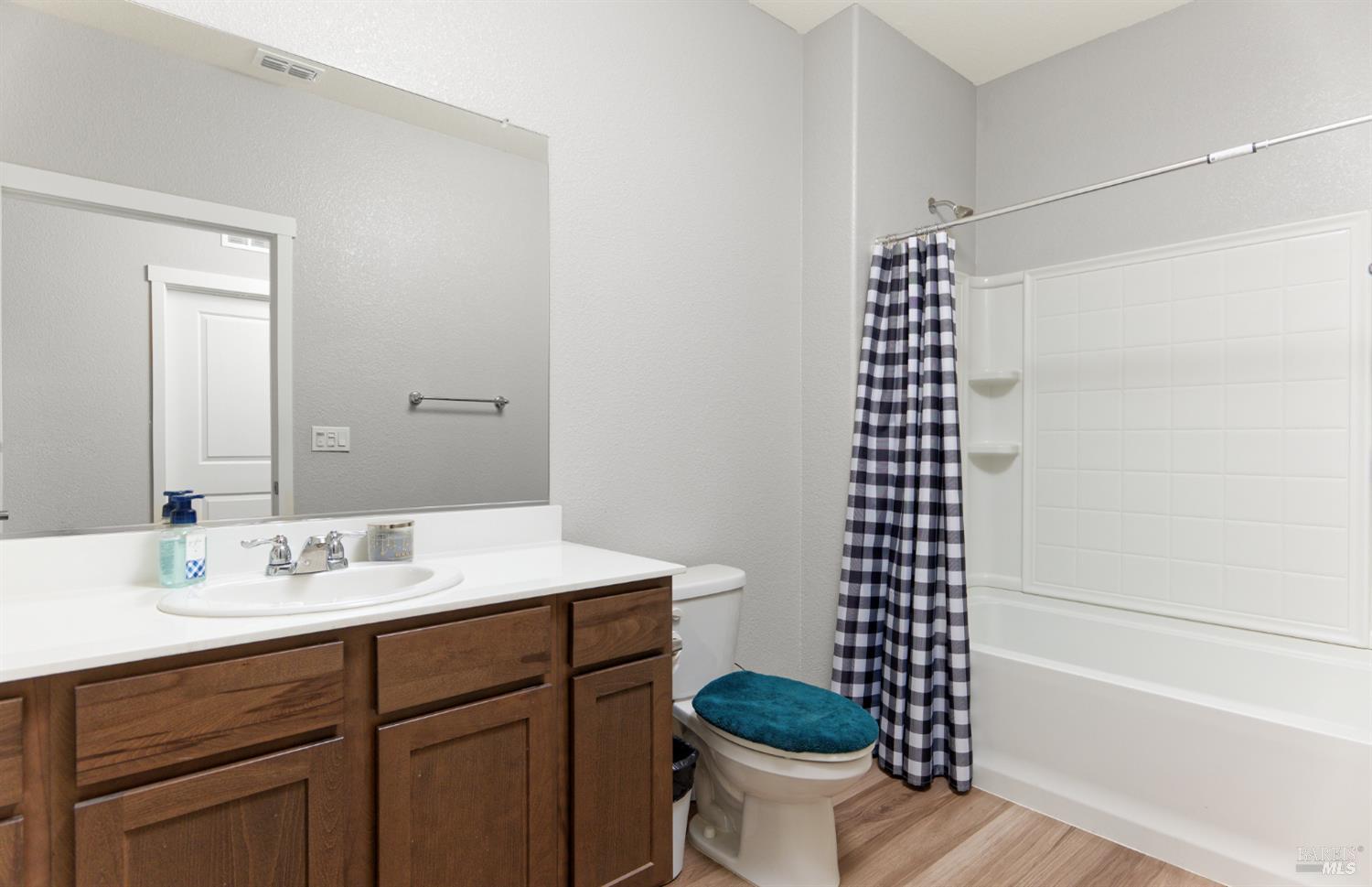 2211 Stars Drive Rio Vista, CA 94571 - Photo 15 of 24 a bathroom with a sink toilet a shower and a mirror