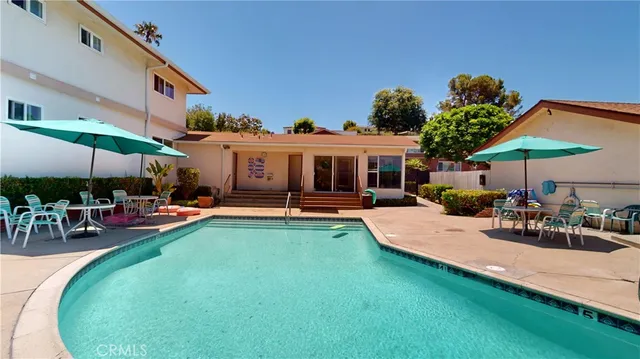 a living room with furniture fireplace and window