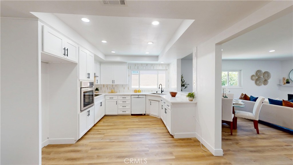 1354 Shadow Lane Fullerton, CA 92831 - Photo 24 of 65 a kitchen with stainless steel appliances kitchen island granite countertop a refrigerator and a stove top oven