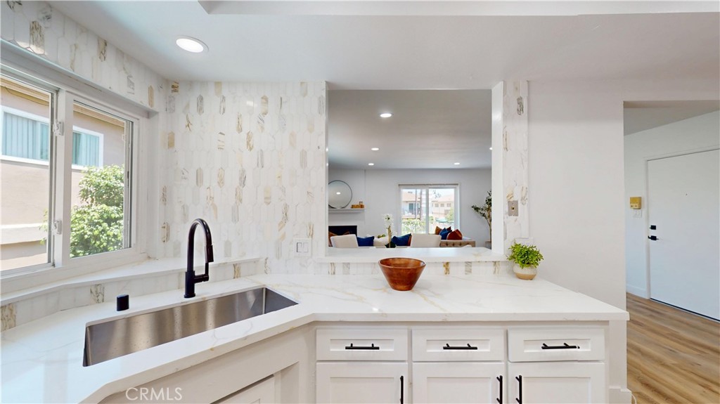 1354 Shadow Lane Fullerton, CA 92831 - Photo 27 of 65 a kitchen with kitchen island a sink appliances and cabinets