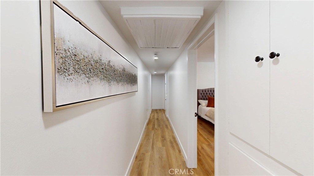 1354 Shadow Lane Fullerton, CA 92831 - Photo 36 of 65 a view of a hallway with wooden floor and staircase