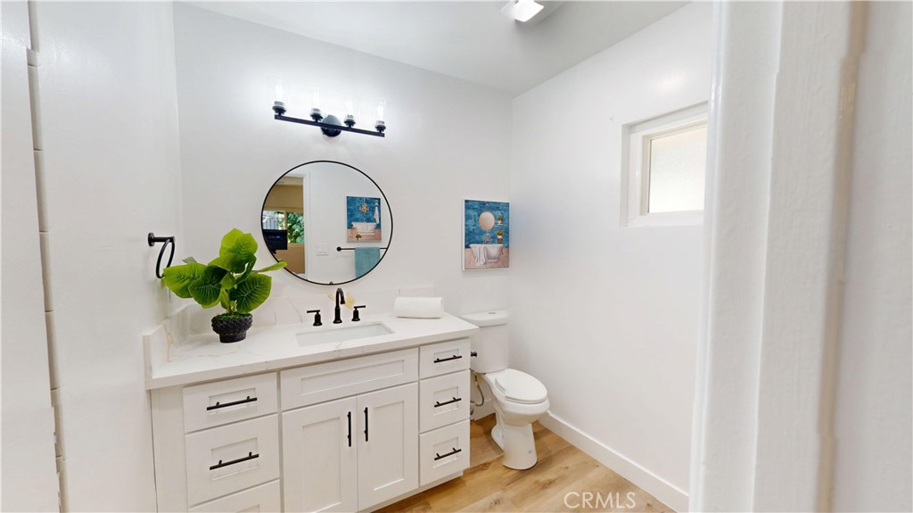 1354 Shadow Lane Fullerton, CA 92831 - Photo 42 of 65 a bathroom with a toilet sink and mirror