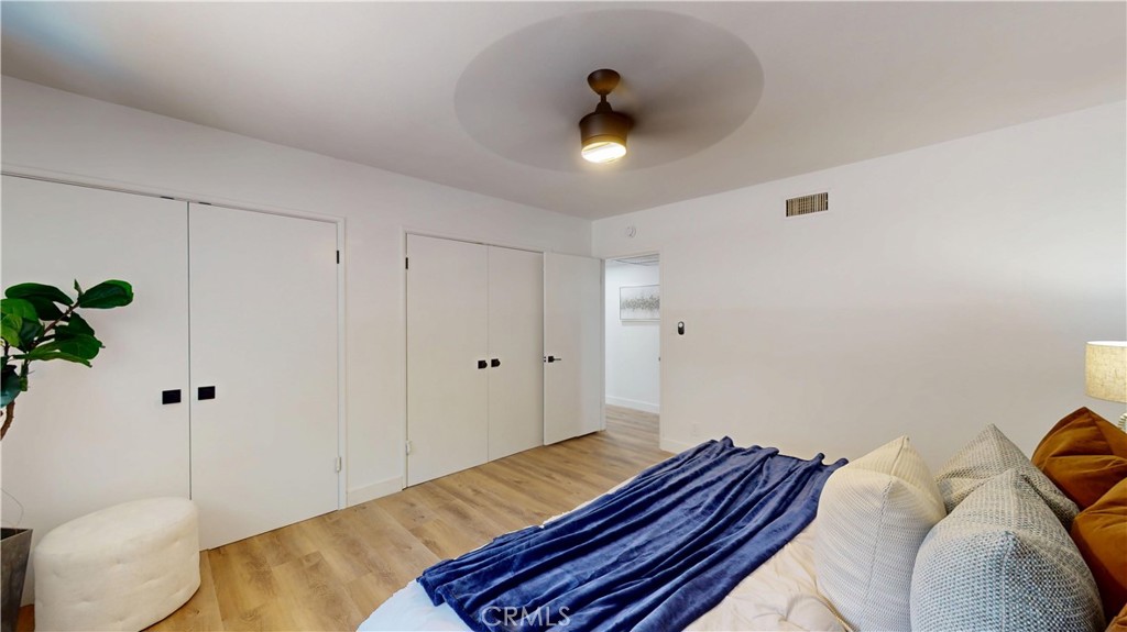 1354 Shadow Lane Fullerton, CA 92831 - Photo 48 of 65 a bedroom with a bed and a chandelier