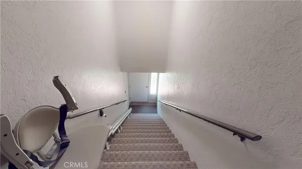 a view of a garden with a building in the background