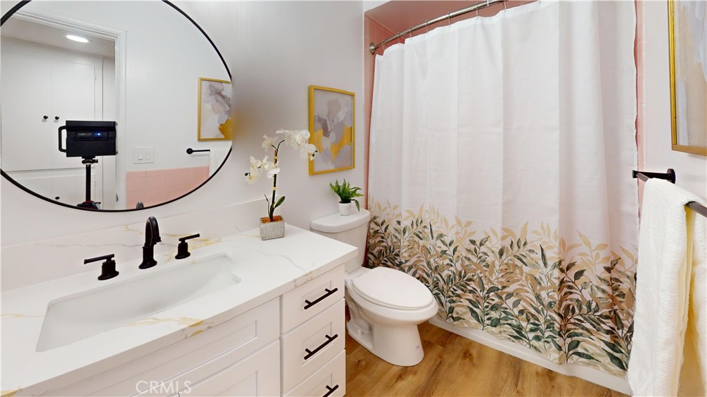 1354 Shadow Lane Fullerton, CA 92831 - Photo 54 of 65 a bathroom with a sink a toilet and mirror