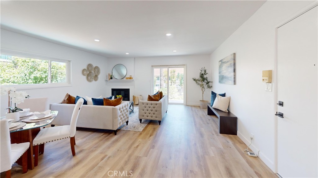 1354 Shadow Lane Fullerton, CA 92831 - Photo 65 of 65 a living room with fireplace furniture wooden floor and a large window