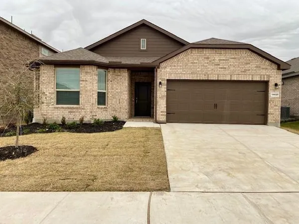 a front view of a house with yard