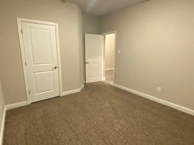 a view of a livingroom with a ceiling fan and window